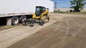 Summer Parking Lot Regrading using a skid steer